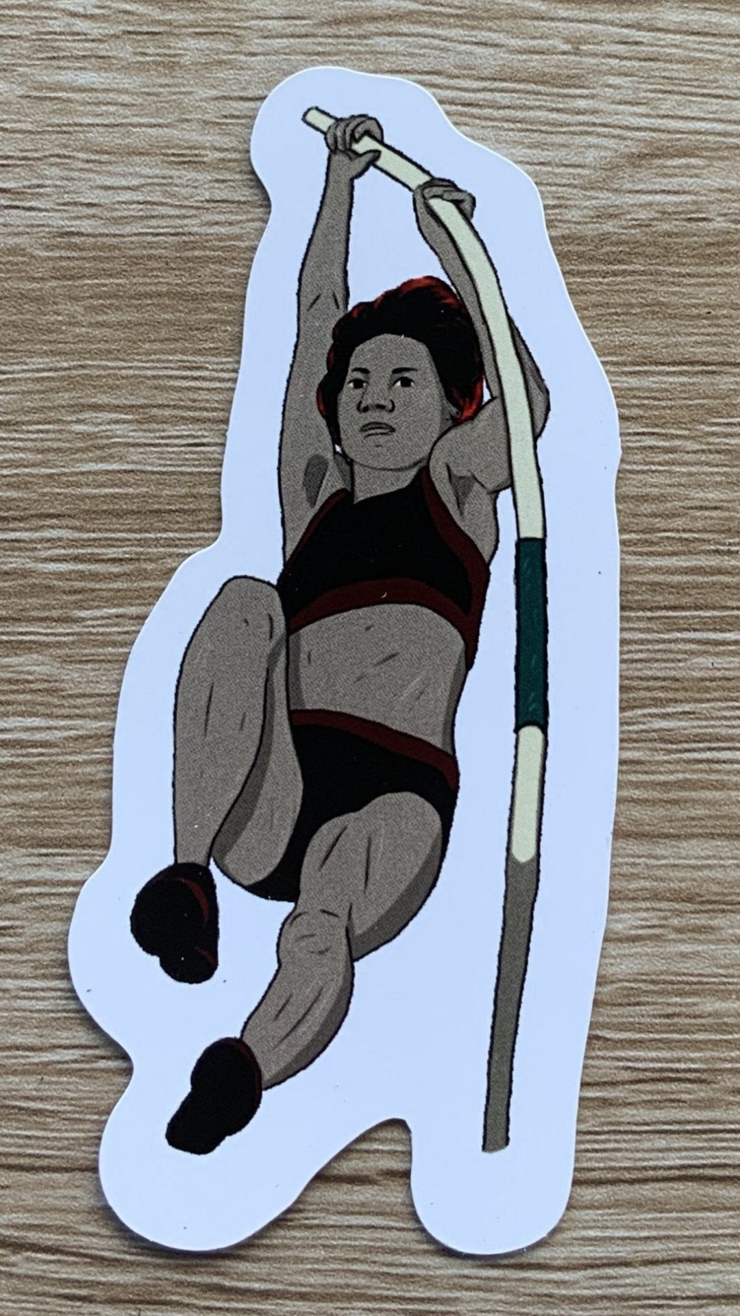 Magnet, aimant de réfrigérateur représentant un sport, elsa abadie penars, athlétisme féminin saut à la perche femme tenue noire et rouge